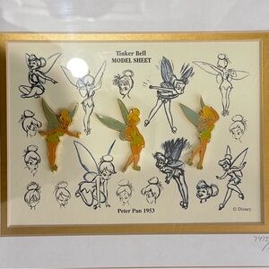 Disney Tinker Bell collectors piece. Pins and print of sketches for the film.